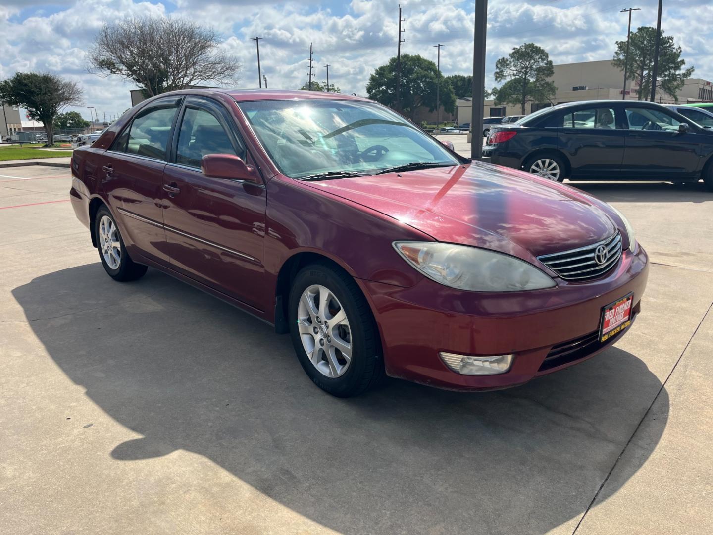 2006 red /TAN Toyota Camry LE V6 (4T1BF30KX6U) with an 3.0L V6 DOHC 24V engine, 5-Speed Automatic Overdrive transmission, located at 14700 Tomball Parkway 249, Houston, TX, 77086, (281) 444-2200, 29.928619, -95.504074 - Photo#0